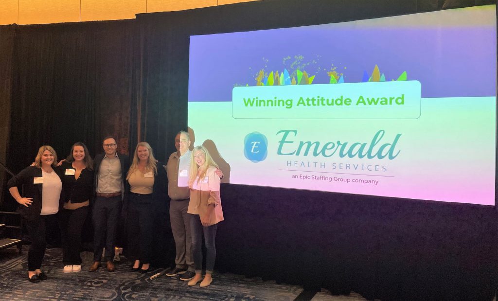 Emerald team accepts award at Symposium 2022